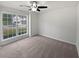 Bright bedroom with carpet flooring and a large window with natural light at 30 Trelawney Ct, Covington, GA 30016
