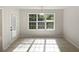 Bright breakfast nook with large window and tile flooring at 30 Trelawney Ct, Covington, GA 30016
