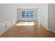 Bright dining room featuring large windows, hardwood floors, and elegant trim at 30 Trelawney Ct, Covington, GA 30016