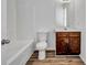 Bathroom features a single sink vanity and shower-tub combo at 3037 Bonnes Dr, Lithonia, GA 30038