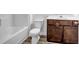 Bathroom features vanity with dark wood cabinets and neutral flooring at 3037 Bonnes Dr, Lithonia, GA 30038