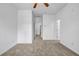 A bright bedroom features neutral carpet and ceiling fan at 3037 Bonnes Dr, Lithonia, GA 30038