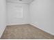 Bedroom with light carpet and window to let in natural light at 3037 Bonnes Dr, Lithonia, GA 30038