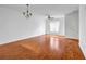 Large living room with ceiling fan and hardwood floors at 3037 Bonnes Dr, Lithonia, GA 30038
