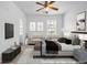 Spacious staged bedroom with neutral carpet, lots of natural light, and modern decor at 3037 Bonnes Dr, Lithonia, GA 30038