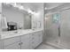 Spa-like bathroom with double vanity, glass-enclosed shower, and modern fixtures at 3982 Carver Cir, Doraville, GA 30360