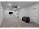 This spacious bedroom has neutral walls, carpet flooring, a ceiling fan, and an ensuite bathroom at 3982 Carver Cir, Doraville, GA 30360