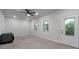 Spacious bedroom with large windows, carpeted floors, and a neutral palette, offering a versatile living space at 3982 Carver Cir, Doraville, GA 30360