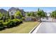 The Heights at Carver Hills entrance with the sign, manicured shrubbery, and a gated entry at 3982 Carver Cir, Doraville, GA 30360