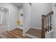Welcoming entryway with hardwood floors, a staircase, and a glimpse into the adjoining room at 3982 Carver Cir, Doraville, GA 30360