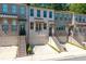 Charming brick townhomes featuring private garages, and individual entrances with landscaped yards at 3982 Carver Cir, Doraville, GA 30360