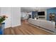 Open-concept living room showcasing hardwood floors and seamless flow to the modern kitchen at 3982 Carver Cir, Doraville, GA 30360