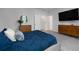 Spacious bedroom featuring a large bed, modern decor, and ample natural light at 3982 Carver Cir, Doraville, GA 30360