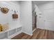 Organized mudroom with bench, hat rack, and hooks, providing a convenient space for entry and storage at 3982 Carver Cir, Doraville, GA 30360