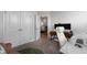 Bright home office with white chair, modern desk, stylish decor, and a view from the open door at 3982 Carver Cir, Doraville, GA 30360