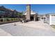 Outdoor kitchen and gathering area with a fireplace, grill, and view of the community at 3982 Carver Cir, Doraville, GA 30360