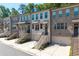 Charming brick townhomes boast private entrances, garages, and manicured landscaping at 3982 Carver Cir, Doraville, GA 30360