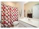 Clean bathroom featuring a shower with decorative curtain and a white vanity at 4306 Laurel Creek Se Ct, Smyrna, GA 30080