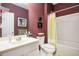 Well-lit bathroom features a shower-tub combination, mirror and sink at 4306 Laurel Creek Se Ct, Smyrna, GA 30080