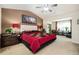 Spacious bedroom boasts a ceiling fan, a large picture, and a comfortable sitting area at 4306 Laurel Creek Se Ct, Smyrna, GA 30080