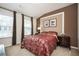 Inviting bedroom featuring neutral walls, carpet flooring, and two windows at 4306 Laurel Creek Se Ct, Smyrna, GA 30080