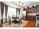 Sunny breakfast area with hardwood floors, large windows, and stainless steel refrigerator at 4306 Laurel Creek Se Ct, Smyrna, GA 30080