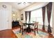 Bright breakfast nook with large bay window, hardwood floors, and elegant window treatments at 4306 Laurel Creek Se Ct, Smyrna, GA 30080