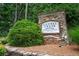 Stone sign for the Laurel Creek Ashton Woods Homes Est. 2009 community at 4306 Laurel Creek Se Ct, Smyrna, GA 30080