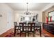 A dining room with wood floors and wainscotting sits between the entry door and the kitchen at 4306 Laurel Creek Se Ct, Smyrna, GA 30080