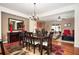 A beautiful dining room with hardwood floors, an elegant chandelier, and ample space for entertaining guests at 4306 Laurel Creek Se Ct, Smyrna, GA 30080