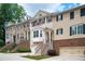 Inviting townhome row with neat landscaping, brick accents, and individual garage entrances at 4306 Laurel Creek Se Ct, Smyrna, GA 30080