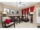 Comfortable living room featuring a ceiling fan, brown sectional, and ample lighting at 4306 Laurel Creek Se Ct, Smyrna, GA 30080