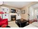 Cozy living room with fireplace, built-in shelving, and a large coffee table at 4306 Laurel Creek Se Ct, Smyrna, GA 30080