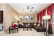 Inviting living room featuring a brown sectional, area rug, and large window at 4306 Laurel Creek Se Ct, Smyrna, GA 30080
