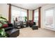 Sitting area with an outside entry, seating, and abundant light at 4306 Laurel Creek Se Ct, Smyrna, GA 30080