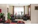 Bedroom sitting area with two chairs, large windows, and a console table at 4306 Laurel Creek Se Ct, Smyrna, GA 30080
