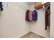 Well-organized walk-in closet with hanging storage and neutral carpet at 4306 Laurel Creek Se Ct, Smyrna, GA 30080