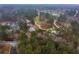 Aerial view showcasing a park with walking paths and a gathering area, surrounded by lush trees and greenery at 4649 Equestrian Way, Atlanta, GA 30338
