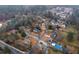 Aerial view of a residential neighborhood, showcasing the diverse architectural styles and mature trees at 4649 Equestrian Way, Atlanta, GA 30338