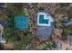 Birds-eye view of community amenities featuring tennis courts, a pool, parking lot, and surrounding greenery and buildings at 4649 Equestrian Way, Atlanta, GA 30338
