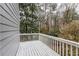 Spacious backyard deck with white railings and lush greenery, offering a serene outdoor living space at 4649 Equestrian Way, Atlanta, GA 30338