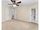 Bright bedroom with ceiling fan, neutral carpet and convenient access to ensuite bathroom at 4649 Equestrian Way, Atlanta, GA 30338