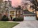 Beautiful two-story brick home with a lush lawn, balcony, and attached two-car garage at 4649 Equestrian Way, Atlanta, GA 30338