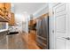 Well-equipped kitchen boasts stainless steel appliances, wooden cabinets, and granite countertops at 4649 Equestrian Way, Atlanta, GA 30338