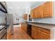 Spacious kitchen with wooden cabinets, granite countertops, and modern appliances at 4649 Equestrian Way, Atlanta, GA 30338