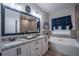 A luxurious bathroom with a double sink granite vanity and a separate tiled shower and tub at 62 Presley Farm Pkwy, Rockmart, GA 30153