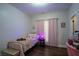 Cozy bedroom featuring a twin bed with pink bedding, plush accents, and decorative artwork at 62 Presley Farm Pkwy, Rockmart, GA 30153