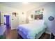 Bright bedroom with a double bed, decorated walls, hardwood floors, and double door closet at 62 Presley Farm Pkwy, Rockmart, GA 30153