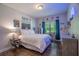 A brightly lit bedroom featuring Marvel decor, a ceiling fan and plenty of natural light at 62 Presley Farm Pkwy, Rockmart, GA 30153
