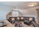 Cozy bonus room featuring a large sectional sofa and a small accent table at 62 Presley Farm Pkwy, Rockmart, GA 30153